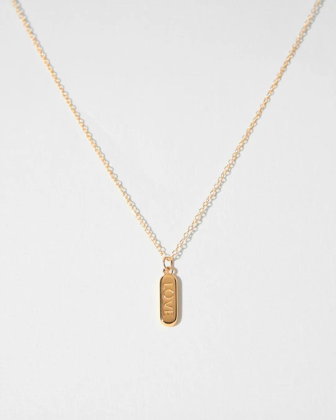 ENGRAVED LOVE PILL NECKLACE